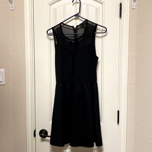Black dress, knee length with see through back.